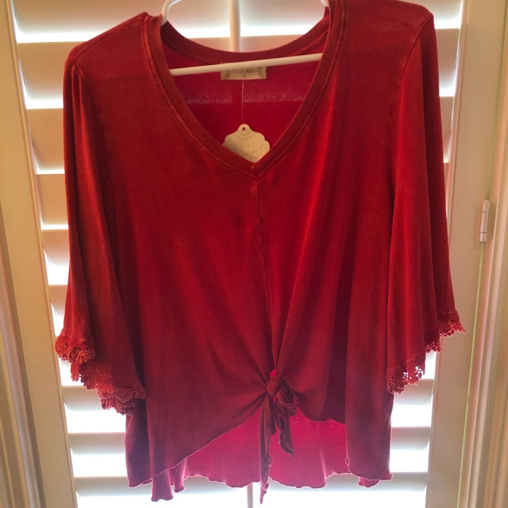 Red knotted blouse